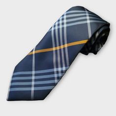 The blue and white plaid pattern on the silk tie is eye-catching and timeless, while the pocket square adds a pop of color and style to your outfit. The cufflinks, made of high quality material, add the perfect finishing touch to your formal attire. 100% Silk Handmade Package Includes: Tie, Pocket Square & Cufflinks. Length: 59" Width: 3.34" Warm iron if needed Classic Blue Ties For Business, Classic Blue Suit And Tie Accessories For Office, Classic Blue Business Ties, Classic Adjustable Blue Suit And Tie Accessories, Elegant Plaid Suit And Tie Accessories For Business, Dapper Blue Business Ties, Plaid Suit And Tie Accessories For Business, Blue Classic Ties For Father's Day, Classic Blue Ties For Father's Day