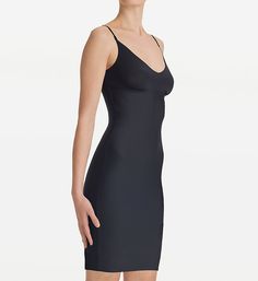 Enjoy a smoother silhouette under your favorite dresses with this sleek microfiber slip. Made of ultra-soft knit nylon, cotton and elastane. Flattering V-neckline has a laser-cut edge. Wireless cups have ruching along the bottom. Sewn-on elastic at inner base of cups keeps a close fit. Four-way stretch for a flexible, body-conforming fit. Sleek microfiber outside, comfy cotton on interior surface. Fabric offers light to moderate compression to smooth out bulges and ripples. Target areas: back, w Elegant V-neck Stretch Shapewear, Fitted Slip Dress With Built-in Bra And Straight Neckline, Sleek Second-skin Shapewear With Built-in Bra, Elegant Seamless Fitted Shapewear, Seamless Fitted V-neck Shapewear, Elegant Stretch Slip Dress With Built-in Bra, Elegant Seamless Solid Shapewear, Elegant Solid Seamless Shapewear, Seamless Second-skin Sleek Shapewear