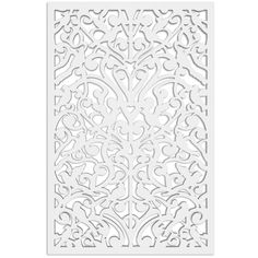 a white laser cutout with an intricate design on the front and back of it