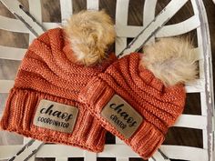 "A cute matching hat set for Mama and her mini! Each set comes with an adult beanie as well as a youth beanie. Adult hat features a leatherette patch with \"Chaos Coordinator\" laser engraved on it and a fur pom pom. Youth hat features a leatherette patch with \"Chaos Creator\" laser engraved on it and a fur pom pom. Each leatherette patch is adhered to the beanie by an industrial heat press and features a faux stitch design. You may choose from several colors including: Rust, Mint, Cream, Light Grey and Beige You may choose between:  1 Adult Hat & 1 Youth Hat 1 Adult Hat & 2 Youth Hats 1 Adult Hat & 3 Youth Hats If additional youth hats are needed, please send us a message for pricing information. CARE: HAND WASH ONLY Colors may appear differently from screen to screen and may not be an a Cute Adjustable Brown Hats, Personalized Brown Hats One Size Fits Most, Playful Brown Hat, One Size Fits Most, Personalized Brown Hats, Cute Fitted Hats As Gifts, Mini Beanies, Chaos Coordinator, Laser Engraved Ideas, Hat Ideas