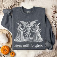 ✨ Celebrate spooky season season in style with our cozy vintage-inspired sweatshirts! Featuring an exclusive retro design printed with eco-friendly inks, these bestselling Gildan 18000 fleece-lined crewnecks offer a comfortable, roomy fit. Perfect for rocking oversized or paired with your favorite jeans for a chic, tucked-in look! ✨ SIZING * Please refer to the size chart in the pictures for exact measurements. * Better yet, simply lay out your favorite sweatshirt and measure it, comparing it to Vintage Halloween Long Sleeve Sweatshirt, Vintage Long Sleeve Halloween Sweatshirt, Fall Goblincore Crew Neck T-shirt, Goblincore Crew Neck T-shirt For Fall, Halloween Band Merch Sweatshirt With Graphic Print, Halloween Cotton Sweatshirt With Graphic Print, Halloween Graphic Print Cotton Sweatshirt, Halloween Goblincore Crew Neck Top, Fall Goblincore Tops With Graphic Print