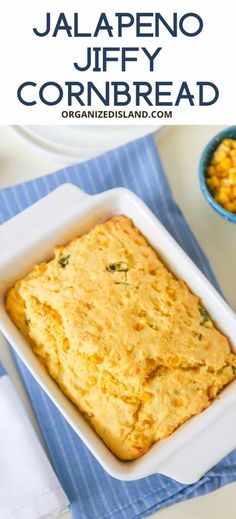 a casserole dish with corn and cheese in it on a blue towel next to a bowl of macaroni and cheese