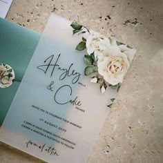 a wedding card with flowers on it