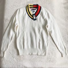 Perfect Unisex Sweater Top From Tommy Hilfiger Featuring Color Block Neck Line W/ Stripe Details 100% Cotton, Soft, Warm And Comfortable! White Long Sleeve V-neck Sweater With Ribbed Cuffs, White Sweater With Ribbed Collar For Spring, White Ribbed Collar Sweater For Spring, White V-neck Sweater With Ribbed Cuffs, Casual White V-neck Long Sleeve Sweater, White V-neck Sweater With Ribbed Collar, White V-neck Top With Ribbed Cuffs, Sporty White Sweater With Ribbed Collar, White Knitted Long Sleeve V-neck Sweater