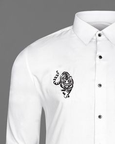 Give yourself a complete makeover as you put on this regular fit, evening-wear tiger embroidered shirt from French Crown. Made using slight sheen fabric blended with pure cotton for utmost comfort and durability, this white shirt features a spread collar, full sleeves, and button-through fastening. Style it with matching trousers and loafers for an impeccable look. Fused collar and cuffs, collar stand and flat felled side seams provide structure and stability to all our shirts. 100 % Premium Cot Embroidery Men’s Shirts, Tiger Clothes, Embroidery Shirt Men, Types Of Textiles, Embroidered Shirts, Embroidery Tshirt, Groom Wear, Shirt Embroidery, White Tiger