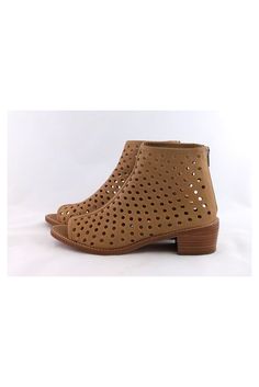 These modern booties have a perforated leather design with a chic open toe. They can be worn during the day with skinny jeans or dresses. Size 8.5 B Leather upper & sole Back zipper Open toe Perforated leather Stacked heel Light outsole wear Heel height 1.75" Trendy Leather Spring Booties, Spring Open-toe Boots With Zipper Closure, Spring Open Toe Boots With Zipper Closure, Spring Ankle Booties With Zipper Closure, Spring Zipper Closure Booties With Round Toe, Ankle-high Booties With Zipper Closure For Spring, Spring Booties With Zipper Closure And Round Toe, Ankle-high Spring Booties With Zipper Closure, Spring Ankle-high Booties With Zipper Closure