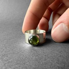 Natural Green Tourmaline Silver Ring - Green Chrome Tourmaline Ring Size 7 - Completely Handmade & Silver Gemstone: Green Tourmaline (Chrome Tourmaline)  Metal: Pure and 925 Sterling Silver Stone Cut: Cabochon Stone Size: 9.0 mm x 9.0 mm - 0.35 in - 0.35 in Weight: 6.22 grams (31.1 carats) total weight of stone and silver. For ring orders, ring resizing is free. Chains are gifts for necklace orders..  Note: We don't use any filters for photos. The details may not be clear. Feel free to contact us with any questions, special orders or additional photo or video requests. We will be happy to provide more information! :) WORLDWIDE FedEx, UPS or TNT EXPRESS MAIL SERVICE (Delivery time: 1 - 5 business days.) LAYAWAY PAYMENT PLAN is available. ABOUT THE TOURMALINE It is a precious stone with a ve Silver Ring Green Stone, Silver Tourmaline Emerald Ring, Tourmaline Birthstone Ring With Bezel Setting, Silver Tourmaline Birthstone Ring, Tourmaline Birthstone Rings, Chrome Tourmaline, Green Chrome, Dope Jewelry, Jewelry Lookbook