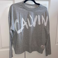 Never Worn In Great Condition. I’m A Size Xs And It Fits Me Great For An Over Sized Sweatshirt Long Sleeve Logo Print T-shirt For Loungewear, Casual Tops With Letter Print For Loungewear, Long Sleeve Logo Print Loungewear T-shirt, Gray Text Print Tops For Loungewear, Oversized Logo Print Tops For Loungewear, Oversized Tops With Logo Print For Loungewear, Sporty Logo Print Tops For Loungewear, Sporty Letter Print Tops For Loungewear, Fall Athleisure Tops With Graphic Print