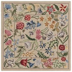 a rug with flowers and leaves on it