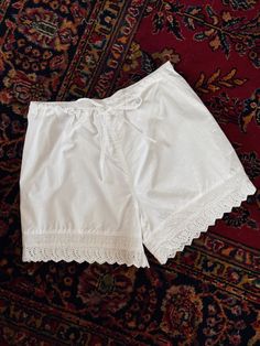 Crafted for comfort with drawstring front and elastic back waist, the Alice shorts are perfect for these sweltering summer days. With matching romantic eyelet detailing, they make an ideal paring with the Alice Top. White Drawstring Pajama Shorts For Summer, Summer Daywear Shorts With Lace Trim, Summer Lace Trim Shorts For Daywear, Cotton Shorts With Lace Trim, Lace Trim Shorts For Daywear, Spring Lounge Shorts With Lace Trim, Spring Loungewear Shorts With Lace Trim, Summer Lace Trim Loungewear Shorts, Summer Loungewear Shorts With Lace Trim