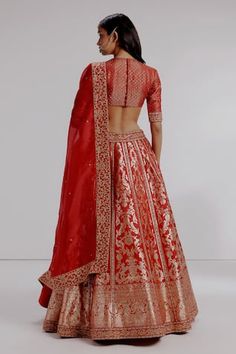 Red pure banarasi katan silk lehenga with bengal tiger, parrots and sequins embroidered motifs. Paired with pure satin silk geometrical checks embroidered blouse and pure silk organza dupatta. - Aza Fashions Festive Meenakari Choli In Raw Silk, Festive Raw Silk Choli With Meenakari, Ceremonial Festive Resham Embroidered Choli, Fitted Meenakari Lehenga For Traditional Ceremonies, Diwali Ceremonial Lehenga With Resham Embroidery, Ceremonial Red Choli For Transitional Season, Festive Ceremonial Lehenga With Zari Work, Ceremonial Fitted Lehenga With Resham Embroidery, Fitted Brocade Lehenga With Meenakari Details