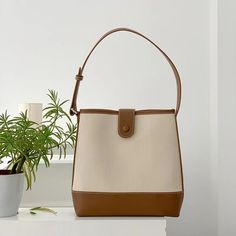 2022 Fall New Style! Size approximately 28cm wide x 26cm tall (11in x 10in) Designer Style ID: 8405 Canvas Bucket Bag with Leather Accent, Retro Vibes, Summer Bag, Beach Shoulder Bag, Work Bag Square Large Capacity Bucket Bag For Shopping, Large Capacity Square Bucket Bag For Shopping, Beige Bucket Bag With Large Capacity For Office, Beige Bucket Bag For Office With Large Capacity, Beige Square Canvas Shoulder Bag, Square Beige Canvas Shoulder Bag, Beige Office Bucket Bag With Large Capacity, Beige Bucket Shoulder Bag For Office, Office Bucket Shoulder Bag With Handles