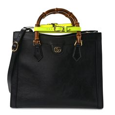 This is an authentic GUCCI Calfskin Medium Diana Tote Bag in Black and Yellow Fluo. This chic shoulder bag is crafted of black calfskin leather. The bag features a looping bamboo top handles, an optional shoulder strap, and aged gold hardware. The top opens to a beige fabric interior with zipper and patch pockets. Gucci Satchel With Detachable Strap For Shopping, Gucci Black Bag With Bamboo Handle, Black Gucci Bag With Bamboo Handle, Gucci Satchel With Leather Lining For Travel, Gucci Satchel With Top Carry Handle For Shopping, Gucci Satchel With Leather Lining, Gucci Satchel With Detachable Strap And Double Handle, Gucci Leather Satchel For Everyday, Gucci Black Shoulder Bag With Bamboo Handle