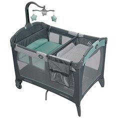 the baby crib has two changing tables and is attached to it's side