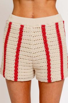 Stay cool and stylish with our Sunset Drive crochet shorts. Made with a breezy open knit design, these shorts are perfect for warm weather. Pair them with our matching top for a complete look. Crafted with 60% cotton and 40% acrylic, these shorts are both comfortable and chic. Say goodbye to boring summer outfits! Beach Season Cotton Shorts, Cotton Shorts For Beach Season And Warm Weather, Spring Knit Shorts, Spring Knit Bottoms, Spring Knit Bottoms Of Short Length, Beach Cotton Bottoms With Crochet Trim, Cotton Beach Bottoms With Crochet Trim, Summer Vacation Crochet Trim Shorts, Vacation Beach Shorts With Crochet Trim