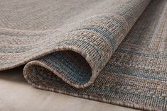 a close up view of a rug with blue and tan colors on it's surface