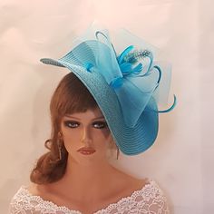 Large  BLUE Hat Fascinator with TURQUOISE Blue Feather and Crinoline loops.  Perfect for Royal Ascot, Kentucky Derby, Wedding, Goodwood revival, Christening, Ascot or any special occasion. Gorgeous  Blue straw weave Hat fascinator  feathers and  Cinoline **Do you like to have this in any other custom colours, Please message. if possible with the dress picture* This hat has been made by hand and very light to wear. This hat is designed to be worn tilted on the side of the head with  long  Quill f Elegant Turquoise Fascinator For Races, Elegant Blue Evening Fascinator, Elegant Blue Headband Fascinator, Luxury Blue Spring Fascinator, Blue Wide-brim Fascinator For Kentucky Derby, Blue Fascinator, Goodwood Revival, Alice Band, Feather Hat