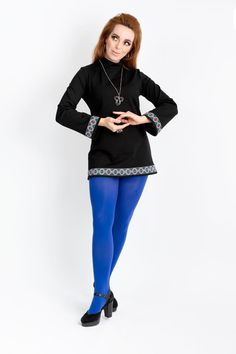 Hippie Shake! Our ethnic tunic is a 1960s-inspired long-sleeved longer shirt or very short A-line mini dress with trumpet sleeves made of Romanit jersey with a stand-up collar. The tunic is decorated with a beautiful border with a geometric pattern in an ethnic design in the colors pink, royal blue, green and black. We have incorporated a concealed zipper on the collar in the back to make it easier to put on and take off. An absolute key piece for your wardrobe, because the tunic can be combined Bohemian Long Sleeve Stretch Mini Dress, Retro Long Sleeve Mini Dress For Fall, Vintage Long Sleeve Mini Dress For Fall, Fall Retro Long Sleeve Mini Dress, Traditional Long Sleeve Tunic For Fall, 1960s Inspired, Sweater Mini Dress, Trumpet Sleeves, Rose Bleu