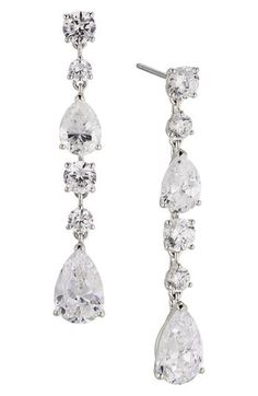 Complete your look with the sparkling glamour of these linear drop earrings set with faceted stones. 1 5/8" drop; 1/4" width Post back Rhodium or 18k-gold plate/cubic zirconia Imported Formal Fine Jewelry Linear Cubic Zirconia Earrings, Formal Teardrop Linear Earrings With Diamond Accents, Fine Jewelry Linear Drop Earrings For Formal Occasions, Elegant Evening Jewelry With Handset Stones, Formal Drop Linear Earrings Fine Jewelry, Elegant Sparkling Linear Earrings For Formal Occasions, Elegant Sparkling Linear Earrings For Formal Events, Classic Long Drop Chandelier Earrings For Formal Occasions, Classic Cubic Zirconia Chandelier Dangle Earrings