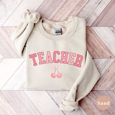 This cozy sweatshirt is perfect for the soft girl teacher in your life! She will love the whimsical elegance of this comfy crewneck. SIZING & SWEATSHIRT INFO: Premium Unisex Gildan 18000 Sweatshirt that are light weight and we use DTG Printing method that lasts 50+ washes! Since these are unisex sizing, women usually like their normal women's size for a more relaxed fit or size up one to two sizes for a more oversized look. If you are not sure what unisex adult shirt size to get, lay a sweatshir Cute Text Print Sweatshirt For Fall, Cute Relaxed Fit Sweatshirt With Letter Print, Long Sleeve Sweatshirt With Text Print For School, Cute Long Sleeve College T-shirt, Winter School Sweatshirt, Cute Sweater With Letter Print And Relaxed Fit, Cute Relaxed Fit Sweater With Letter Print, Cute Letter Print Sweatshirt For School, White Sweatshirt For Teacher Appreciation In Fall