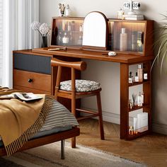 a bedroom with a bed, desk and mirror in it's corner next to a window