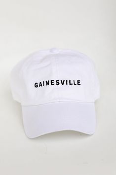 Calling all Gainesville residents, the Gainesville Embroidered Hat was made just for you! This cute hat is made of a soft cotton construction. It has a rounded top and a slightly rounded brim with "Gainesville" embroidered on the front! Adjustable Strap Embroidered 100% Cotton Spot Clean with Damp Cloth or Sponge One Size Fits Most Cute Hat, Red Icons:), Embroidered Hat, Exclusive Dress, Embroidered Hats, Cute Hats, Trending Accessories, Red And White, Dress Up