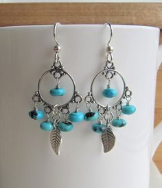 Turquoise and Silver Leaf Earrings, Chandelier Hoop Earrings, December Birthstone Gift, Handmade Earrings Silver, Blue Turquoise Earrings **ABOUT THESE EARRINGS** **SEE MEASUREMENTS BELOW** ❤️These super fabulous boho inspired earrings feature five hand wrapped blue Arizona Kingman Turquoise rondelles warpped to each sterling silver chandelier. I have added sterling silver leaves to the center of each earring and dropped all of these luscious elements from sterling silver ear wires. These beauti Turquoise Dangle Hoop Earrings, Turquoise Chandelier Dangle Earrings, Silver Leaf Earrings, Engraved Locket, Blue Sapphire Necklace, Mothers Bracelet, Earrings Chandelier, Silver Leaves, Silver Chain Bracelet