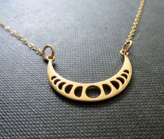 Natural golden bronze moon charm showing each phases. 14k gold filled fine chain. also available in sterling silver and vermeil/14kgf(last pic) Celestial jewelry Moon charm-33x16.5mm to go back to the main shop-NYMETALS-ETSY-click here https://www.etsy.com/shop/nymetals all celestial jewelry https://www.etsy.com/shop/NYmetals/search?search_query=celestial&order=date_desc&view_type=gallery&ref=shop_search Pyrography Jewelry, Gem Necklaces, Diamond Circle Necklace, Moon Phases Necklace, Gem Necklace, Circle Diamond, Gold Diamond Necklace, Celestial Jewelry, Moon Jewelry