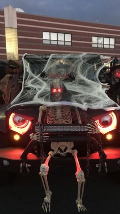 a car with a skeleton on the hood