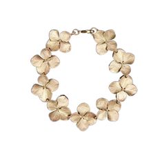 Carry a reminder of the love in your life with this elegant hydrangea bracelet. When I think of hydrangeas, I think back to spring days with my family, of togetherness. While there are many meanings attributed to hydrangeas, each meaning comes back to love. The Hydrangea flowers are cast in bronze with an antique bronze over copper finish. Measures: 7.5" L Made in USA Boxed with Romance Card Shipping and Handling Included About Michael Michaud The Michael Michaud Jewelry Collection is a world-re Michael Michaud, Beautiful Symbols, Hydrangea Flowers, Botanical Collection, Botanical Jewelry, Personalized Bridesmaid Gifts, Hydrangea Flower, Victoria And Albert Museum, Forget Me Not