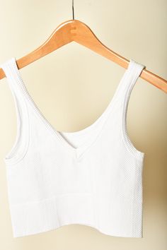 A jb and me fan favorite, these Nikibiki tanks are one-size, but are so stretchy and sturdy! You'll love pairing these tanks with any button up or tee, or wearing them alone! Oh- and they're reversible! Wear it forwards or backwards for a v-neck or a scoop neck, it's up to you! Brand: Nikibiki Content: 92% Nylon | 8% Spandex White Seamless V-neck Top, Everyday Ribbed V-neck Tank Top, Everyday Seamless V-neck Tank Top, Everyday V-neck Seamless Tank Top, Everyday V-neck Crop Top, Seamless Cotton V-neck Tank Top, Cotton Seamless V-neck Tank Top, Cotton V-neck Tank Top For Loungewear, V-neck Tops With Seamless Construction For Everyday