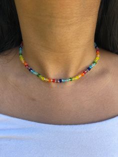 Adjustable beaded choker Necklace length can be adjusted from 12.5in-15.5in Choker is made from rainbow frosted glass seed beads (size 6/0) and clear seed beads (size 11/0) Necklace care: avoid wearing in water or to sleep to keep necklace in the best shape. Store in a cool, dry place. Overtime, the clasp and chain may begin tarnish. Cheap Trendy Rainbow Beaded Necklaces, Adjustable Rainbow Beaded Choker Necklaces, Adjustable Beaded Choker Necklace, Casual Adjustable Beaded Necklace With Faceted Beads, Casual Adjustable Faceted Beads Necklace, Casual Adjustable Faceted Beaded Necklace, Adjustable Crystal Necklaces With Colorful Beads For Festivals, Adjustable Multicolor Crystal Choker Necklace, Multicolor Single Strand Bead Choker