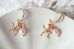 Starfish Earrings dangle , starfish earrings stud, Gold Starfish Earrings , gold earrings for women Golden hoop earrings with a lovely starfish pendant and a beautiful freshwater pearl. All materials are 24K gold plated and are tarnish-resistant, water-resistant, and hypoallergenic. CARE INSTRUCTIONS: To preserve the quality of your earrings, I recommend that these not be worn in water. Avoid spraying perfume directly onto the surface. PACKAGING & SHIPPING: Your earrings will arrive nicely packa Gold Elegant Earrings With Starfish Charm, Elegant Gold Earrings With Starfish Charm, White Starfish Charm Earrings For Gift, White Starfish Charm Earrings As Gift, White Starfish Charm Earrings, Handmade Ocean-inspired Star Earrings, Starfish-shaped Earrings With Star Charm For Gift, Starfish Earrings With Star Charm As Gift, Starfish Charm Hoop Earrings As Gift