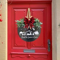 a red door with a christmas wreath on it