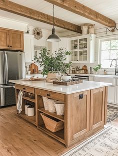 a large kitchen with an island in the middle and lots of baskets on top of it