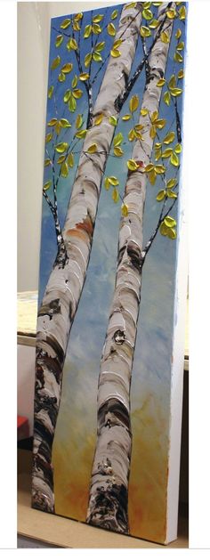 an acrylic painting of two birch trees with yellow leaves on the branches and blue sky in the background