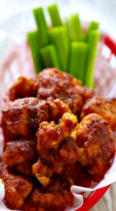 meatballs and asparagus in a basket on a table