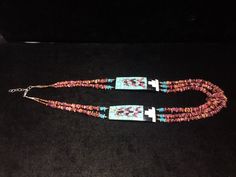 "Native American Indian, Santo Domingo Pueblo artist Raymond Rosetta's unusual handmade vintage multi-stone Corn inlay, multi-strand necklace, with turquoise, purple & orange spiny oyster, mother of pearl, jet, pin shell (backing) & sterling silver beads, including handmade stamped cones at the end before adjustable finish... Beautiful! 2 strands above Corn inlay pendants, 3 strands beneath... Corn inlay pendants are 3 3/8\" x 1 1/8\" x 3/16\" deep. 29-31\" long necklace (short strand) - Indian Corn, Turquoise And Purple, Necklace Turquoise, Spiny Oyster, Mother Pearl, Purple Orange, Multi Strand Necklace, Native American Indians, American Indian