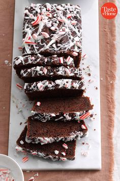 chocolate cake with white frosting and candy canes