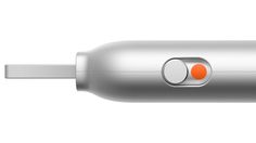 an electric toothbrush with two orange buttons on it's side and the top part of its head