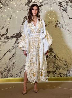 Festive White Kaftan With Woven Motifs, Elegant Long Sleeve Kaftan With Multicolor Embroidery, Elegant Spring Kaftan With Floral Embroidery, Elegant Floral Embroidered Kaftan For Spring, Festive White Kaftan With Gold Embroidery, White Long-sleeve Kaftan With Woven Motifs, White Long Sleeve Kaftan With Woven Motifs, Elegant White Kaftan For Festival, Elegant Floral Embroidered Tunic Kaftan