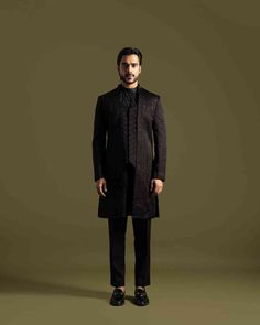 The Achkan, made from high-quality Black Linen Satin, features a double panel design with unique center stitching and is embellished with detailed thread work, Chir, and Sequins for a luxurious finish

Size Chart For Men





	
	
					Men's Size Chart
		

		
		
						
				Size Chart For Men
				Custom Size Measurement Guide
			
			
				
				
				Custom Size Measurement Guide
1. Take your measurements at ease…don’t hold your breath!
2. Be a little generous with the measurements. It’s always easie Designer Tailored Outerwear For Festive Occasions, Designer Tailored Outerwear For Festive Season, Embroidered Tailored Sherwani For Semi-formal Occasions, Luxury Festive Semi-formal Outerwear, Designer Nehru Jacket With Naqshi For Formal Occasions, Designer Bandhgala With Zari Work, Designer Bandhgala With Intricate Embroidery, Luxury Designer Kurta With Resham Embroidery, Designer Sherwani With Resham Embroidery