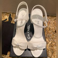 Hello!!! I Hope You Will Love These Shoes As Much As I Did When Purchasing Them! I Have Never Worn This Shoes Other Than For Pictures At My House For About 10 Mins For My Wedding Day!! These Are Brand New Chanel Bow White Sandal Heels!! I Bought These At The Wynn Las Vegas Chanel Boutique! They Are So Special To Me But They Are Too High For Me So I Want To Sell Them! If You Have Any Questions Please Let Me Know!! All Original Packaging Of The Box. These Are Perfect Shoe To Have In Your Collectio Wedding Heels Chanel, White Heels Chanel, Wedding Heels Luxury, Coquette Shoes Aesthetic, White Luxury Heels, Chanel White Heels, Classy White Heels, Luxury White Sandals With Heel Strap, Designer White Sandals With Heel Strap