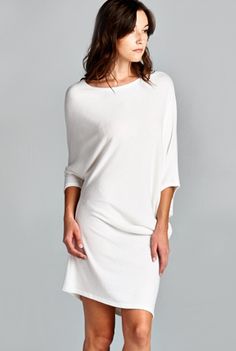 This sophisticated off the shoulder dress is the perfect storm of sexy meets elegant, meets edgy. Why this is in out Top 10 list of wardrobe staples is because its versatility as both a dress and a long top! With 3/4 dolman sleeves and a boatneck, the tunic can be kept as simply dress. Pull it off one shoulder, add some heels and you have a great date dress! Dress has some sheerness and we recommend wearing a nude slip underneath. Only 3 left! Available in off-white. 62% polyester, 33% rayon and Casual White Off-shoulder Bodycon Dress, White Knee-length Sweater Dress, Chic White V-neck Sweater Dress, Winter Off-shoulder Stretch Sweater Dress, Chic Stretch Sweater Dress Off-shoulder, The Perfect Storm, Date Dress, Simply Dress, Clothes Board