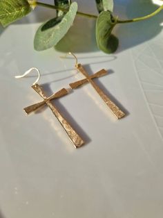 A beautiful pair of large raw hammered gold cross brass earrings. These earrings are delightful and stunning. They are simple yet beautiful,hanging from your ears. These big cross earrings dangle  have a beautiful, beaten shiny finish, and there will make a perfect gift for yourself or your loved ones.  Cross:L 5cm            W 2.3cm Length with hooks is 6cm Style: Gold Cross Earrings Minimalist Gold Cross Earrings, Gold Cross Pendant Earrings As Gift, Gold Cross Pendant Earrings For Gift, Gold Nickel-free Cross Earrings, Nickel-free Gold Cross Earrings, Gold Cross-shaped Pierced Earrings, Gold Cross Earrings, Big Cross, Christian Christmas