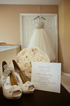 the wedding dress and shoes are on display in front of a card that reads, new jersey venue