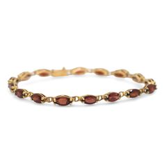 Specifications: Pre-Owned Metal: 14K Yellow Gold Stone: Garnet Stone Weight: 7.80  cttw Stone Color: Orange Wheight: 8.4 g. Oval Diamond Jubilee Bracelet In 14k Gold, Oval Jubilee Diamond Bracelet In 14k Gold, 14k Gold Oval Diamond Jubilee Bracelet, Timeless Oval Yellow Gold Diamond Bracelet, Timeless Yellow Gold Oval Diamond Bracelet, Formal Oval Link Fine Jewelry Bracelets, Formal Oval Gold Bracelet With Polished Finish, Classic Yellow Gold Bracelet With Gemstone, Classic Oval Gemstone Tennis Bracelet