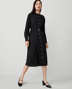 Keep it modern and easy with our pleated midi shirtdress, cinched with a beautifully belted silhouette. Stand collar. Long sleeves with button cuffs. Button front. Front and back knife pleats. Self tie belt. Back yoke. Lined body.,Hit:28" from natural waist,Imported:Imported,Fit:Hits below the knee,Fabrication:100% Polyester,Garment Care:Machine Washable Pleated Belted Midi Shirtdress by Ann Taylor Size regular - 14 Black Women's Shirtdress, Regular, Open, Front, Long, Sleeve, Dresses, 100%, Pol Classic Black Pleated Dress For Work, Elegant Belted Pleated Dress For Work, Pleated Midi Dress For Work In Fall, Pleated Midi Dress For Fall Workwear, Elegant Button-up Shirt Dress With Pleated Waist, Fall Workwear Pleated Midi Dress, Chic Button-up Dress With Pleated Waist, Chic Shirt Dress With Pleated Waist For Daywear, Belted Knee-length Pleated Dress For Work