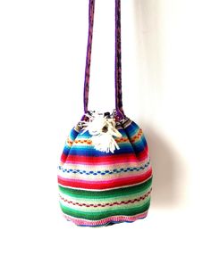 Measurements:  Height: 8 inches (20 centimeters) Base diameter: 5.5 inches  (14 centimeters) Strap length : 44 inches (112 centimeters) Black lining inside. Multicolor Handwoven Bucket Bag As A Gift, Multicolor Woven Bucket Bag As Gift, Multicolor Woven Bucket Bag Gift, Multicolor Woven Shoulder Bag As Gift, Handmade Multicolor Pouch Bucket Bag, Colorful Handmade Pouch Shoulder Bag, Bohemian Multicolor Bucket Bag Gift, Handmade Multicolor Pouch Shoulder Bag, Traditional Multicolor Bucket Bag For Daily Use