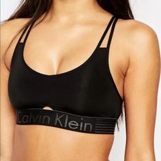 Calvin Klein Iron Strength Micro Bralette Qf1537 Black New With Tag I Have Quiet A Few In Stock, If You Need More Than One, Pls Message Me. :) Iron Strength Logo Bralette Sporty Sweet Bralette From The Pros That Know At Calvin Klein. Soft Cup Style In A Luxe Second-Skin Fabric With A V-Neck, Tiny Cutout At Bust Band And Thin Strappy Back. Pull On Style Finished With A Supportive Striped Logo Elastic Bust Band For That Signature Look That Always Stands Apart. Nylon, Elastane. Hand Wash Calvin Klein Outfits, Calvin Klein One, Calvin Klein Bralette, Calvin Klein Ck One, Bralette Outfit, Calvin Klein Women, Black Bralette, Sporty Outfits, Trx